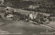 Norberg. Flygfoto av Karbennings Kyrka och Prästgård